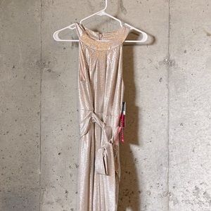 Shimmer jumpsuit with waist tie.